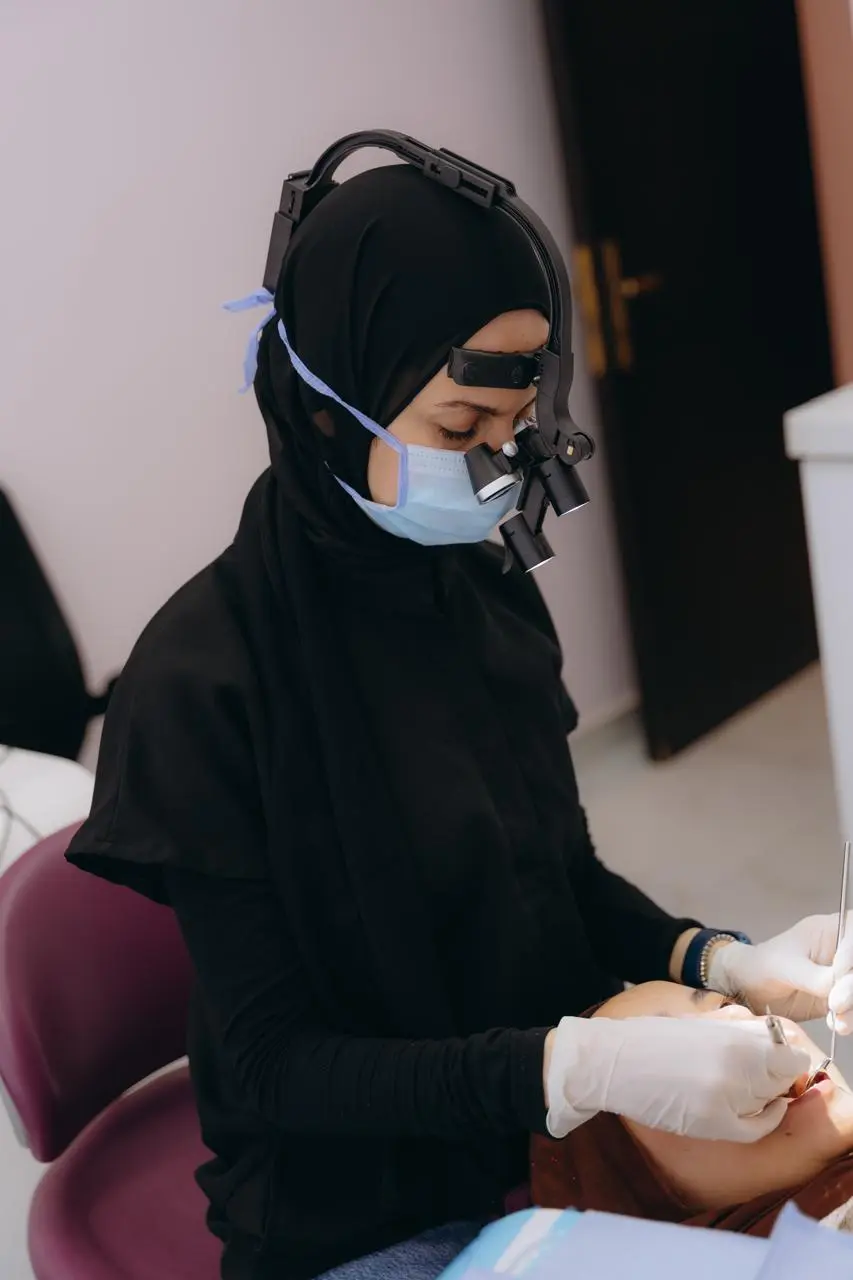 Dr. Nermeen providing dental care in clinic
